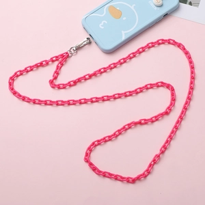 Detail showing bright pink acrylic chain link phone strap with silver spring clip hook