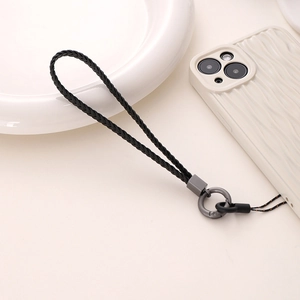 Detail of black woven phone wrist strap with dark gray matte metal ring buckle