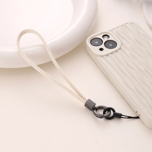 Close-up of white braided leather phone wrist strap with dark grey metal hardware