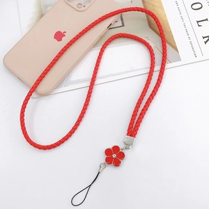 Detail of red woven phone lanyard with camellia floral charm and silver metal connector