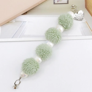 Light green plush ball phone strap with faux pearls and silver heart charm pendant