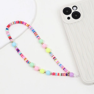 Detailed view of colorful clay and candy beads phone strap attached to white case