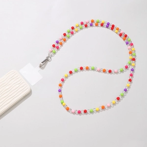 Detail of colorful acrylic beaded phone strap with silver lobster clasp and clear patch
