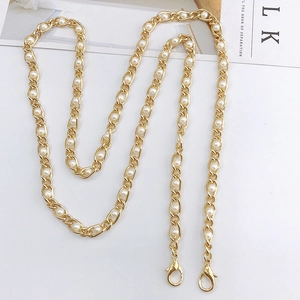 Elegant gold chain strap with interwoven white pearls and swivel lobster clasps