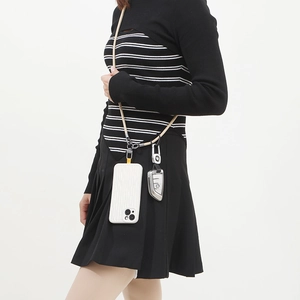 Beige 6mm woven crossbody phone lanyard with metal hooks shown worn on a model