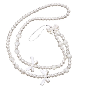 Crossbody pearl phone strap with acrylic hearts, bows, and shells for women