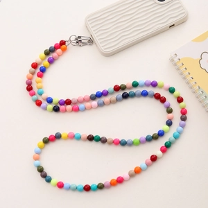 Colorful multi-color beaded crossbody phone strap with silver lobster clasp on case