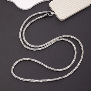 Macro shot of silver rhinestone crossbody phone strap with durable dark grey metal clasp