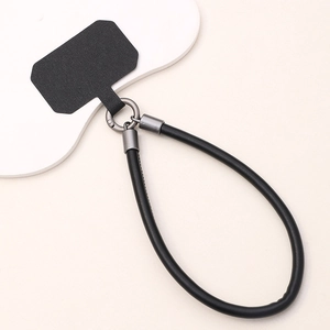 Detail of durable black leather phone wrist strap with gunmetal quick-release ring