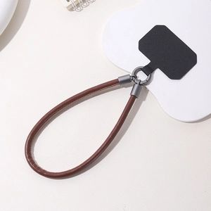 Short brown leather phone wrist strap with grey metal lobster clasp and black insert pad