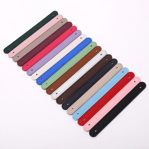 Close-up of colorful litchi pattern PU leather wrist straps with fine stitching