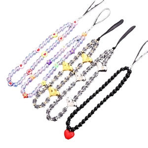 Colorful heart and star beaded phone charms set with acrylic pearls on white background