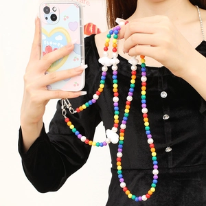 Rainbow beaded long phone lanyard shown on model as a stylish crossbody strap