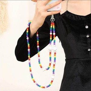 Rainbow beaded phone strap with cloud charms and metal lobster clasp worn as crossbody