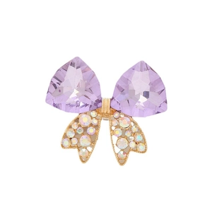Exquisite purple crystal bowknot accessory with AB rhinestones and gold plating on white background