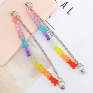 Colorful resin gummy bear double chain bracelet with silver metal rings on pink phone