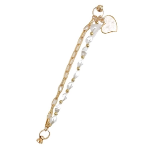 Gold double-layer beaded bracelet featuring irregular pearls and a white heart pendant