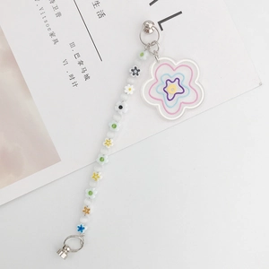 Detail of floral phone charm with acrylic flower pendant and colorful beaded strap