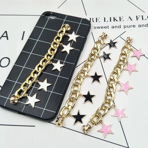 Golden Cuban chain phone charms with enamel star pendants in white, black and pink
