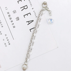 Double chain silver bracelet with white beads and iridescent star pendant accessory