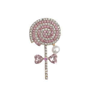 Zinc alloy lollipop brooch with pink rhinestones, pearls and crystal bow detail