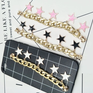 Detailed close-up of golden alloy star charm chains for DIY phone cases and accessories