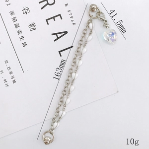 Dual-layer bracelet with silver metal chain, white heart beads and crystal heart pendant