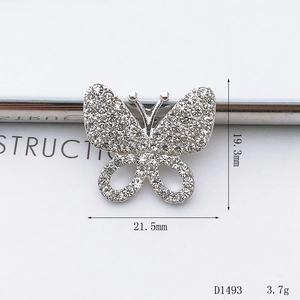 Detailed macro view of butterfly jewelry accessory with dimensions 21.5mm by 19.3mm
