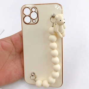 Creamy white phone case with rose gold frame, beaded chain and 3D bear charm