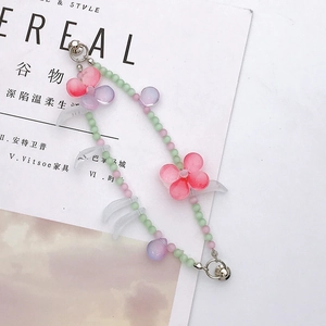 Detail of beaded flower chain with pastel glass beads and silver clasp on Cereal magazine