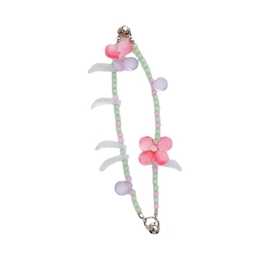 Floral beaded bracelet featuring pink and green resin pearls with a metal bell charm