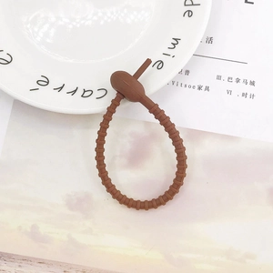 Brown silicone cable tie and DIY accessory with adjustable non-slip ring texture