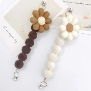 Acrylic flocked flower charms set in brown and white with metallic rings and soft texture