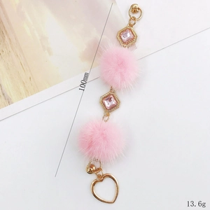 Chaîne de coque téléphone avec pompon rose, strass et pendentif cœur doré élégant