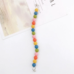 Close-up of colorful rubber finish acrylic beads with silver spring hooks and rings