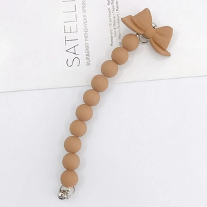 Matte brown acrylic beaded strap with bow charm and silver metal clasps for phones