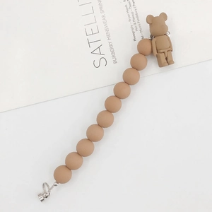 Brown acrylic beaded phone strap with a bear figurine and a durable metal clip