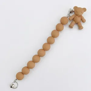 Dragonne en perles mates kaki avec pendentif ourson pour téléphones ou porte-clés