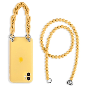 Close-up of matte yellow DIY phone case with detachable acrylic chain and beaded strap