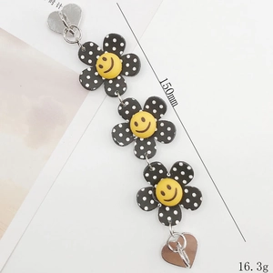 Chaîne de fleurs à pois noirs avec sourires jaunes et fermoirs en forme de cœur