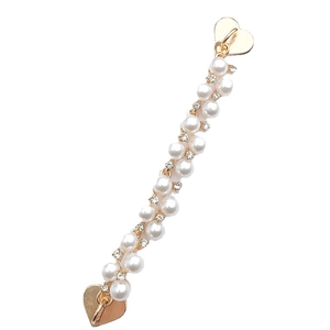 Elegant white faux pearl bracelet with golden heart charms and shimmering rhinestones