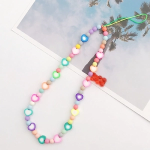 Rainbow beaded phone strap with macaron colors, heart beads and a red gummy bear pendant