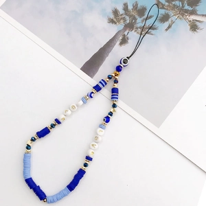 Detail view of Bohemian evil eye phone charm with blue wooden beads and LOVE letters