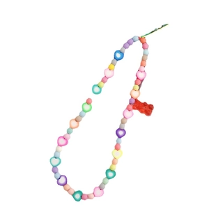 Colorful beaded phone strap with macaron stars and a red gummy bear charm hanging