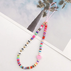 Close-up of colorful polymer clay bead phone strap with gold accents and LOVE letter beads