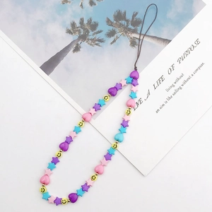 Close-up of candy-colored star and heart beaded phone strap with yellow smiley face bead