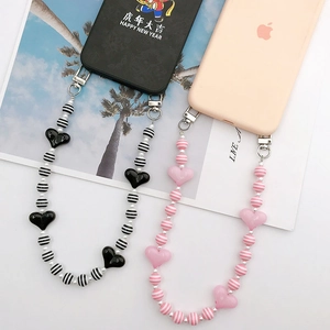 Acrylic heart and striped bead phone charm strap set with metal clasps on cases