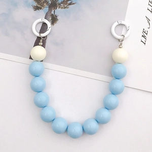 Detail of 16mm light blue and cream acrylic beads on a summer style decorative phone chain