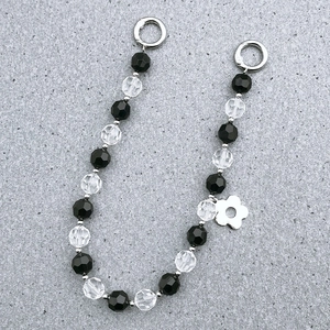 Acrylic faceted beaded strap with silver flower pendant and circular spring clasps
