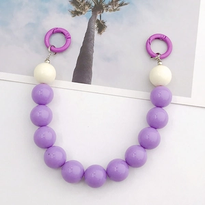 Detail view of 16mm purple and white acrylic beaded strap with metal spring buckles